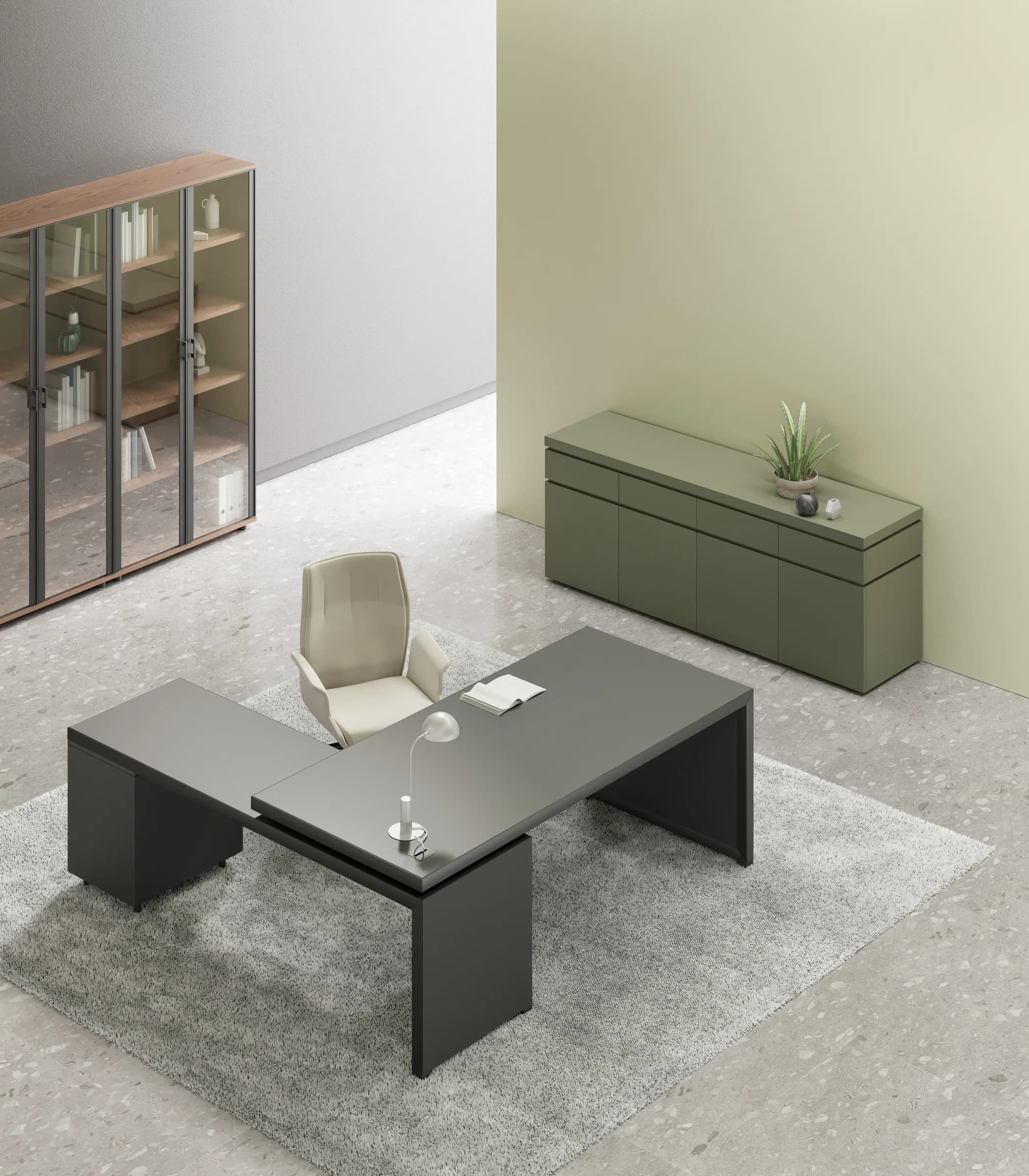 Veduta dall'alto della composizione Galvano: piano grigio, allungo, cassettiera e credenza verde salvia sul fondo