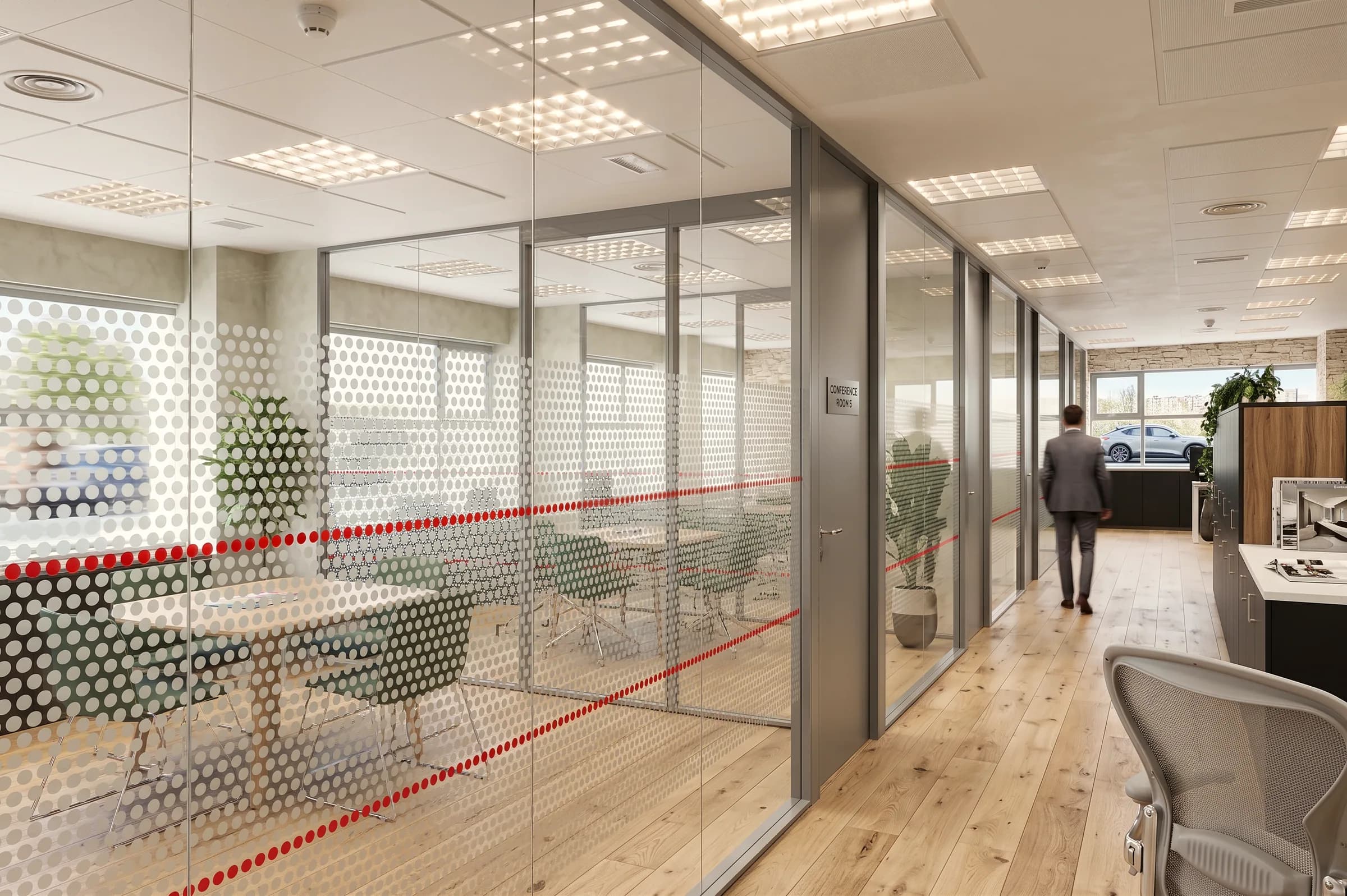 Parete divisoria in vetro trasparente decorato con pellicola, profili grigi e porte integrate nell’ufficio.